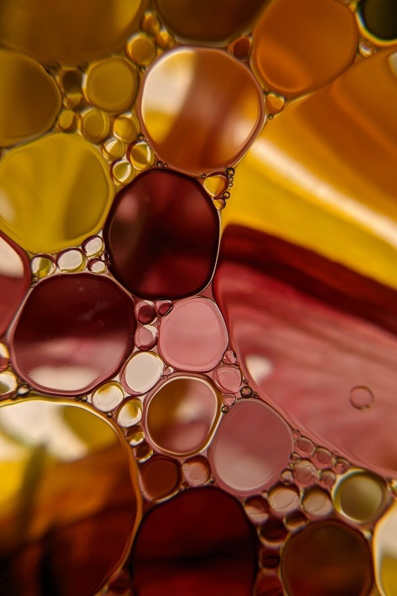 Photo by Susan Wilkinson water droplets on yellow and red textile